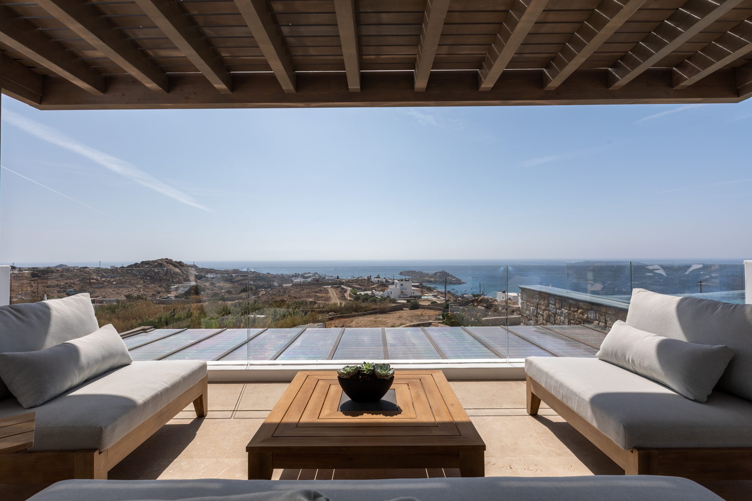 Sheltered outdoor terrace looking toward the Aegean Sea
